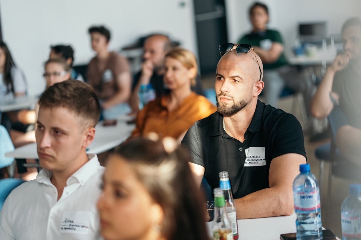 Participants listening intently during a session